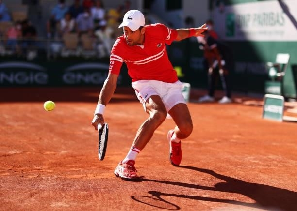 Novak Djokovic of Serbia plays a backhand in his Men's Singles Final match against Stefanos Tsitsipas of Greece during Day Fifteen of the 2021 French...