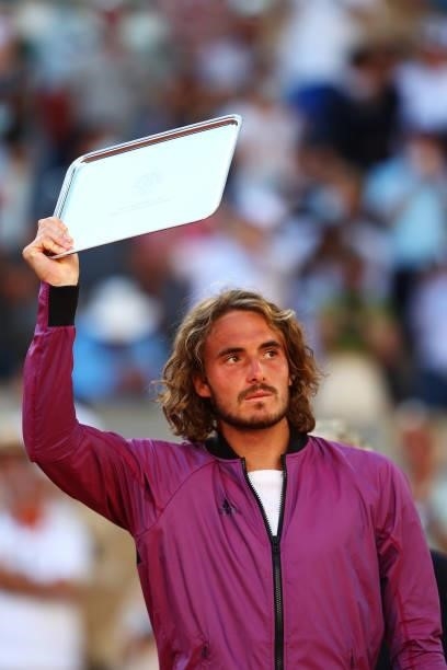 Runner-up Stefanos Tsitsipas of Greece lifts his trophy after loosing his Men's Singles Final match against Novak Djokovic of Serbia during Day...
