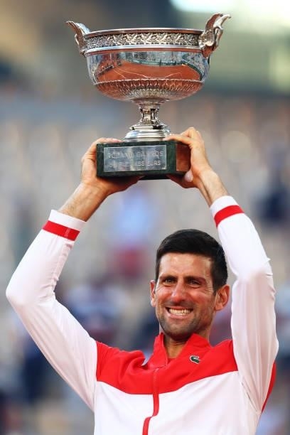 Novak Djokovic of Serbia celebrates as he lifts the trophy after winning his Men's Singles Final match against Stefanos Tsitsipas of Greece during...