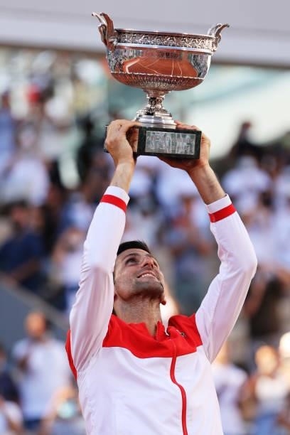 Novak Djokovic of Serbia celebrates as he lifts the trophy after winning his Men's Singles Final match against Stefanos Tsitsipas of Greece during...