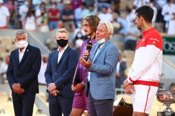 Former tennis player Bjorn Borg talks on the podium during the presentation ceremony after the Men's Singles Final match between Novak Djokovic of...