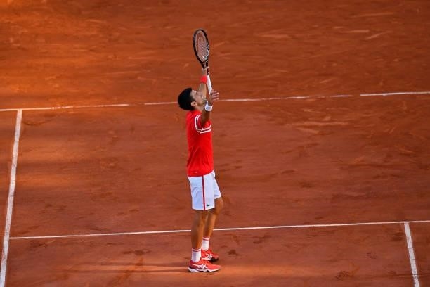 Novak Djokovic of Serbia reacts after winning his Men's Singles Final match against Stefanos Tsitsipas of Greece during Day Fifteen of the 2021...