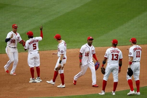 Members of the Washington Nationals celebrate their 5-0 win over the San Francisco Giants at Nationals Park on June 13, 2021 in Washington, DC.