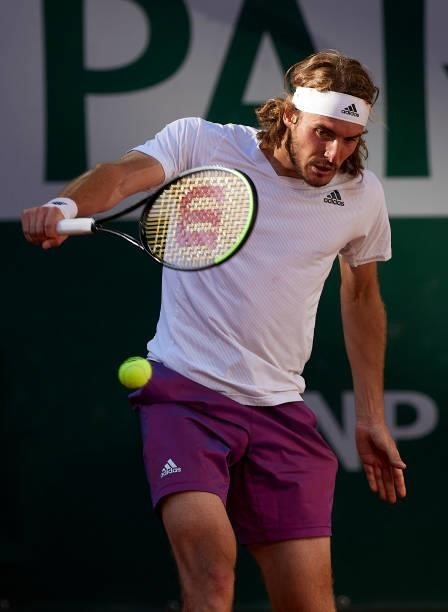 Stefanos Tsitsipas of Greece plays a backhand shot in his Men's Singles Final match against Novak Djokovic of Serbia during day fifteen of the 2021...
