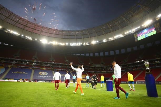 Players of Venezuela and Brazil enter the pitch before a Group B match between Brazil and Venezuela as part of Copa America 2021 at Mane Garrincha...