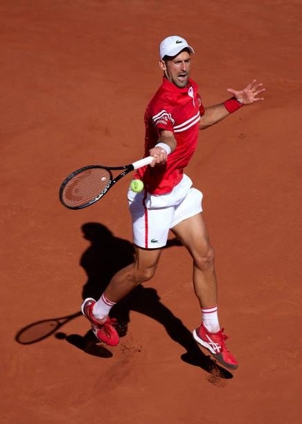 Novak Djokovic of Serbia returns a ball in his Men's Singles Final match against Stefanos Tsitsipas of Greece during day fifteen of the 2021 French...