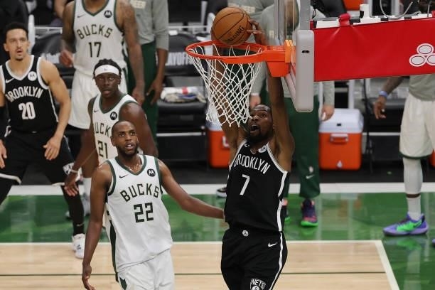 Kevin Durant of the Brooklyn Nets dunks against the Milwaukee Bucks during the second half of Game Four of the Eastern Conference second round...
