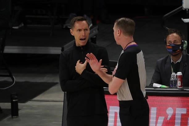 Head coach Steve Nash of the Brooklyn Nets speaks with referee Ed Malloy during the second half of Game Four of the Eastern Conference second round...
