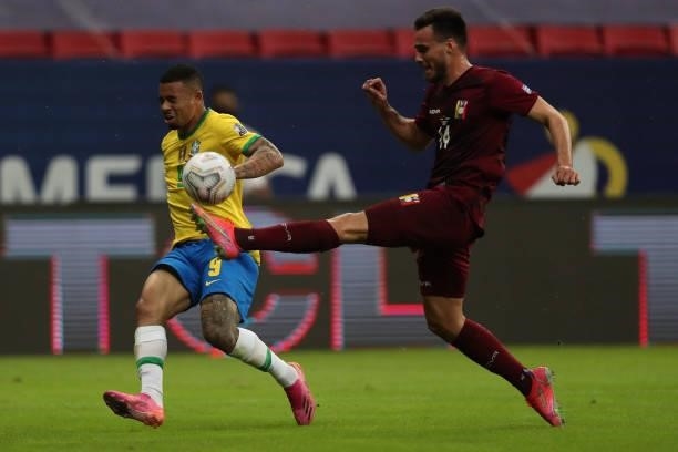 Gabriel Jesus of Brazil competes for the ball with Luis Mago of Venezuela during a Group B match between Brazil and Venezuela as part of Copa America...