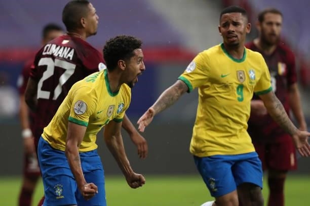 Marquinhos of Brazil celebrates with teammate Gabriel Jesus after scoring the first goal of his team during a Group B match between Brazil and...