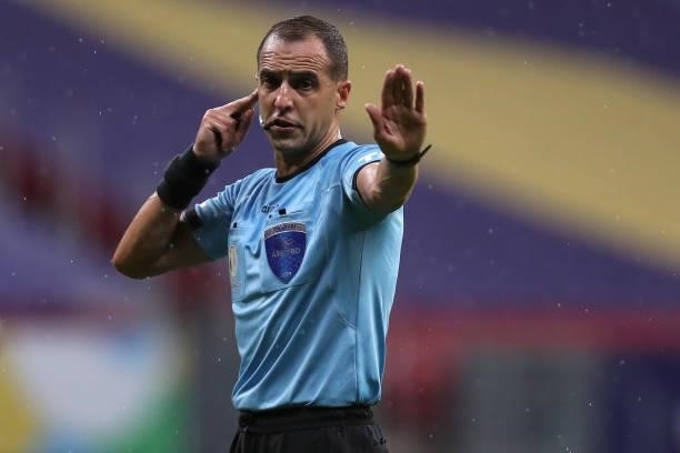 Referee Esteban Ostojich gestures during a Group B match between Brazil and Venezuela as part of Copa America 2021 at Mane Garrincha Stadium on June...
