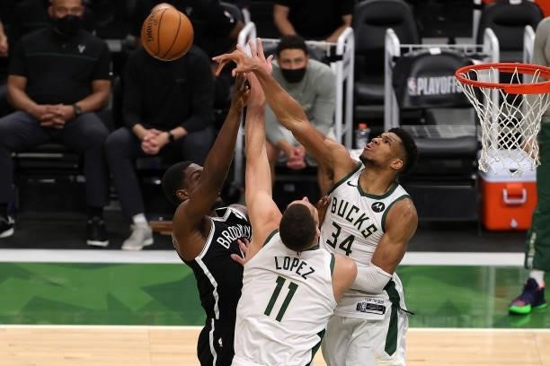 Giannis Antetokounmpo of the Milwaukee Bucks blocks a shot by Reggie Perry of the Brooklyn Nets during the second half of Game Four of the Eastern...