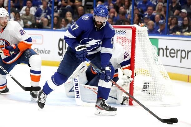 Alex Killorn of the Tampa Bay Lightning handles the puck against the New York Islanders during the third period in Game One of the Stanley Cup...