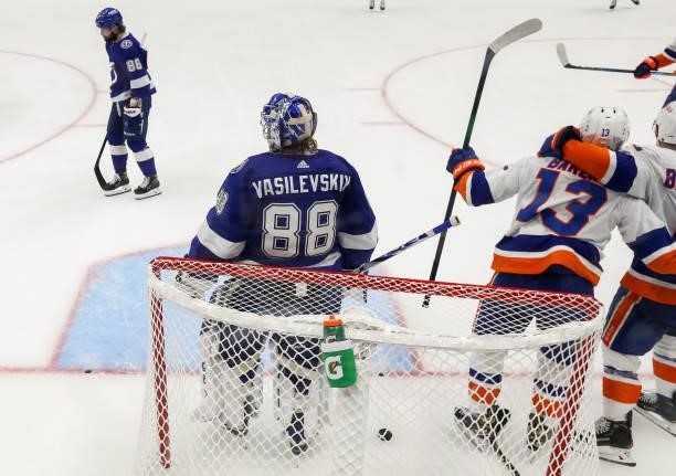 Mathew Barzal of the New York Islanders is congratulated by Anthony Beauvillier after scoring a goal past Andrei Vasilevskiy of the Tampa Bay...