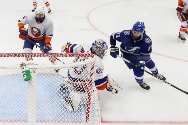 Semyon Varlamov of the New York Islanders defends the net against Anthony Cirelli of the Tampa Bay Lightning during the third period in Game One of...