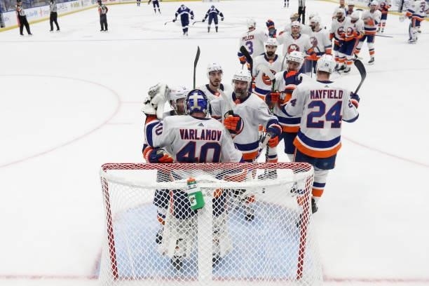 Semyon Varlamov of the New York Islanders celebrates with his teammates after their 2-1 victory against the Tampa Bay Lightning in Game One of the...