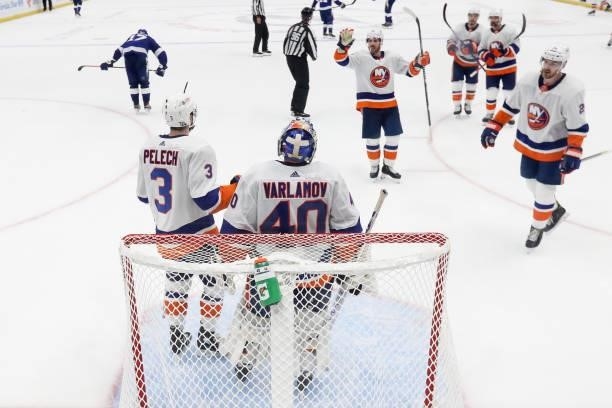 Semyon Varlamov of the New York Islanders celebrates with his teammates after their 2-1 victory against the Tampa Bay Lightning in Game One of the...