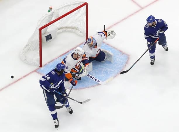 Semyon Varlamov of the New York Islanders turns away the puck against Pat Maroon of the Tampa Bay Lightning during the second period in Game One of...