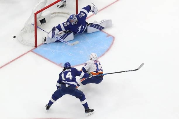Andrei Vasilevskiy of the Tampa Bay Lightning makes the save against Mathew Barzal of the New York Islanders during the third period in Game One of...