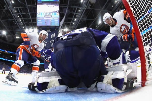 Anthony Beauvillier and Jean-Gabriel Pageau of the New York Islanders are stopped by Andrei Vasilevskiy of the Tampa Bay Lightning in Game One of the...