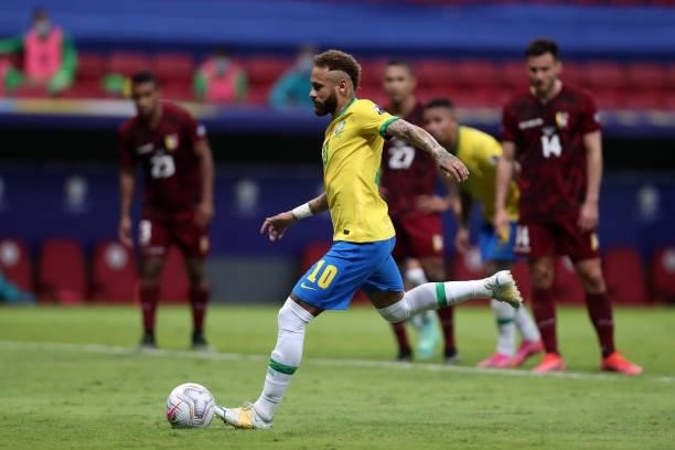 Neymar Jr. Of Brazil kicks a penalty to score the second goal of his team during a Group B match between Brazil and Venezuela as part of Copa America...