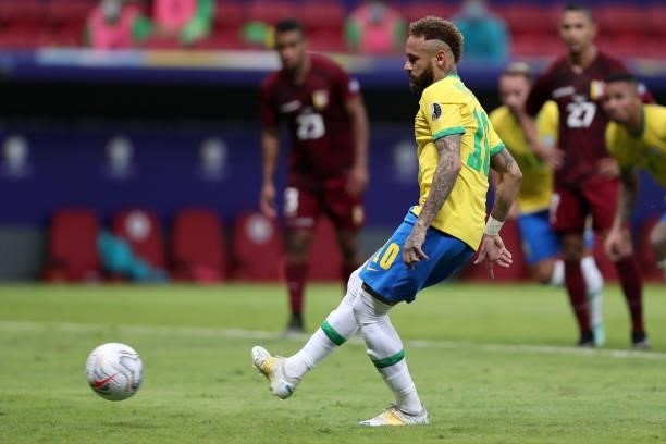 Neymar Jr. Of Brazil kicks a penalty to score the second goal of his team during a Group B match between Brazil and Venezuela as part of Copa America...