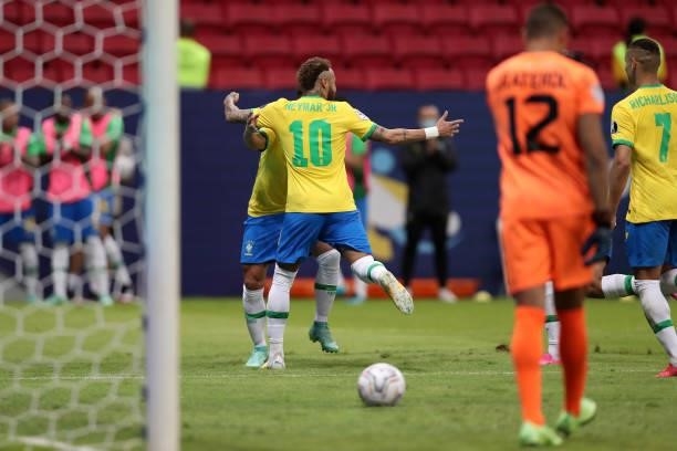 Neymar Jr. Of Brazil celebrates with teammates after scoring the second goal of his team during a Group B match between Brazil and Venezuela as part...