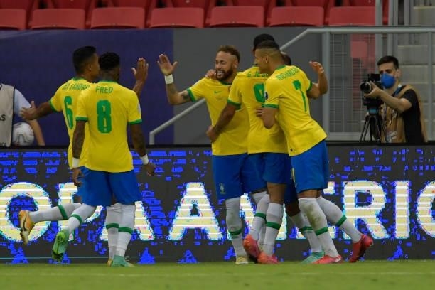 Neymar Jr. Of Brazil celebrates with teammates after scoring the second goal of his team during a Group B match between Brazil and Venezuela as part...