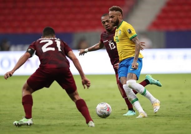 Jose Martinez of Venezuela competes for the ball with Neymar Jr. Of Brazil during a Group B match between Brazil and Venezuela as part of Copa...