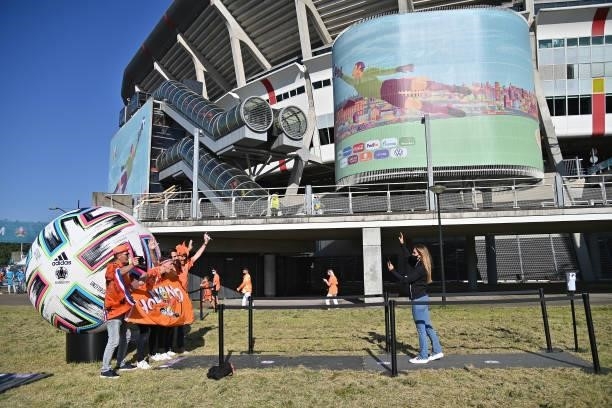 Fans of Netherlands pose near a Adidas Uniforia official ball installation prior the UEFA Euro 2020 Championship Group C match between Netherlands...
