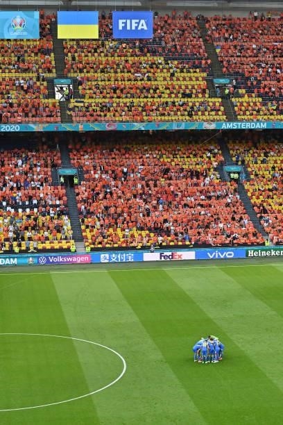 Players of Ukraine gather during the UEFA Euro 2020 Championship Group C match between Netherlands and Ukraine on June 13, 2021 in Amsterdam,...