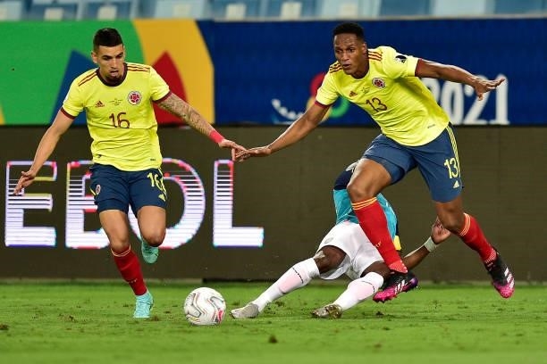 Enner Valencia of Ecuador competes for the ball with Daniel Muñoz and Yerry Mina of Colombia during a Group B match between Ecuador and Colombia at...