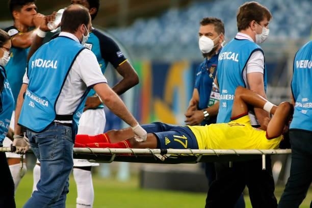 Yairo Moreno of Colombia leaves the field in a stretcher after being injured during a Group B match between Ecuador and Colombia at Arena Pantanal on...
