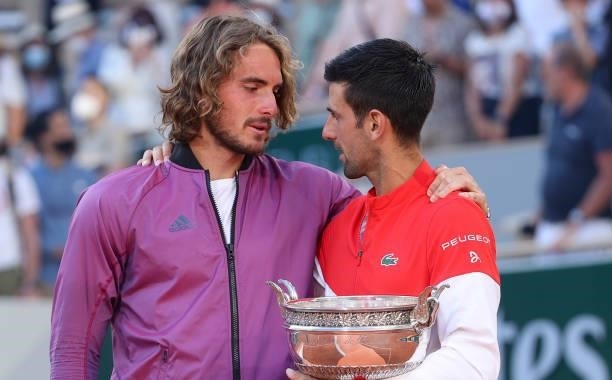 Finalist Stefanos Tsitsipas of Greece, winner Novak Djokovic of Serbia during the trophy ceremony for the Men's Singles final on day 15 of the French...