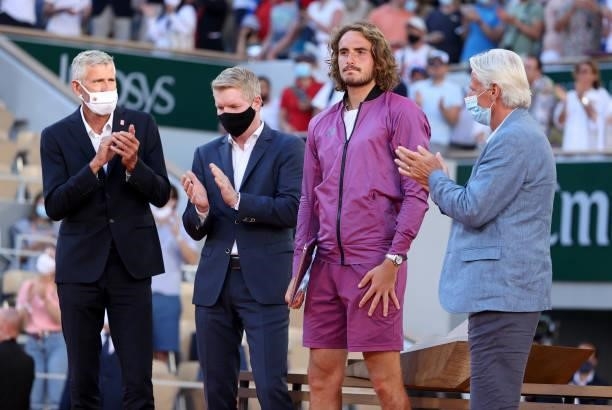 Finalist Stefanos Tsitsipas of Greece between President of French Tennis Federation FFT Gilles Moretton, Jim Courier, Bjorn Borg during the trophy...