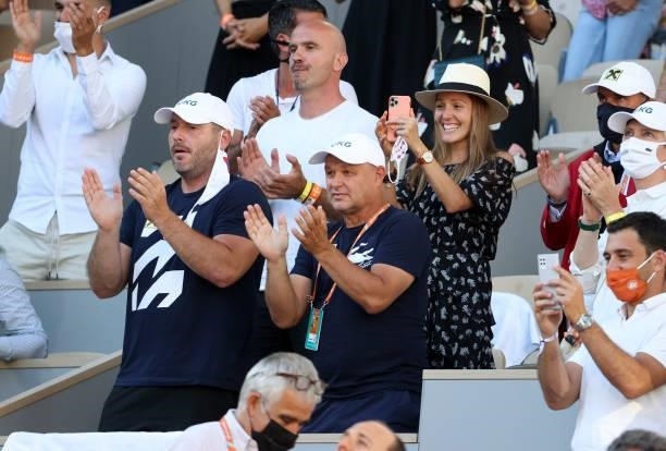 From left, Miljan Amanovic, physio of Novak Djokovic of Serbia, his coach Marian Vajda, his wife Jelena Djokovic celebrate Novak's victory in the...