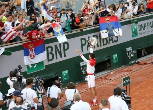 Novak Djokovic of Serbia thanks the fans of Serbia following his victory in the Men's Singles final on day 15 of the French Open 2021, Roland-Garros...
