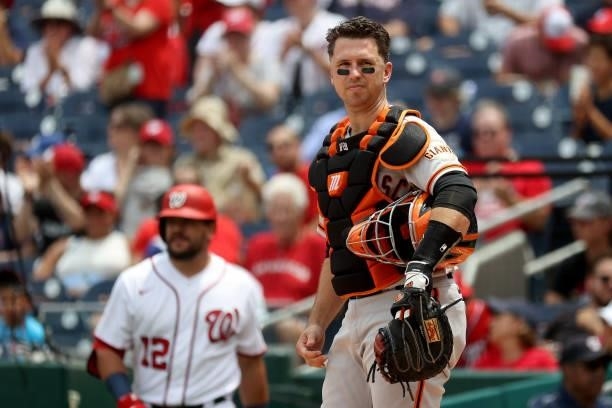 Catcher Buster Posey of the San Francisco Giants looks on against the Washington Nationals at Nationals Park on June 13, 2021 in Washington, DC.
