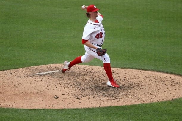 Sam Clay of the Washington Nationals pitches to a San Francisco Giants batter in the ninth inning at Nationals Park on June 13, 2021 in Washington,...