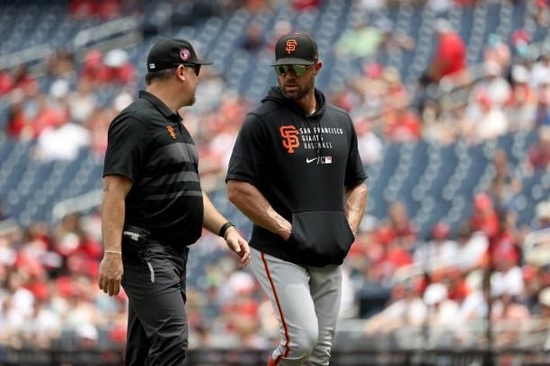 Manager Gabe Kapler of the San Francisco Giants walks off the mound against the Washington Nationals at Nationals Park on June 13, 2021 in...