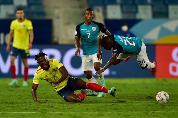 Duvan Zapata of Colombia competes for the ball with Sebastian Mendez of Ecuador during a Group B match between Ecuador and Colombia at Arena Pantanal...
