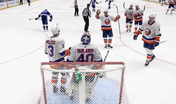 The Islanders celebrate victory against the Tampa Bay Lightning in Game One of the Stanley Cup Semifinals during the 2021 Stanley Cup Playoffs at the...