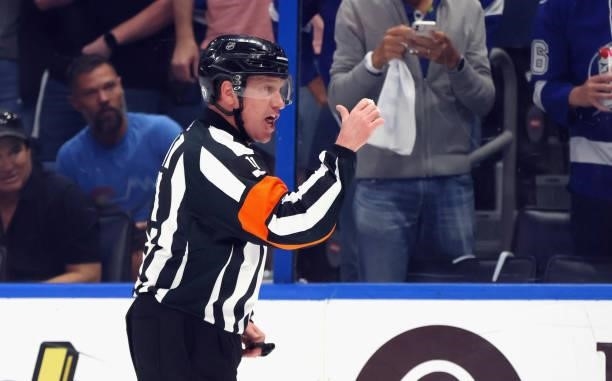 Referee Kelly Sutherland works the game between the New York Islanders and the Tampa Bay Lightning in Game One of the Stanley Cup Semifinals during...
