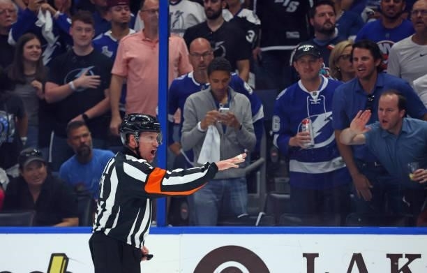 Referee Kelly Sutherland works the game between the New York Islanders and the Tampa Bay Lightning in Game One of the Stanley Cup Semifinals during...