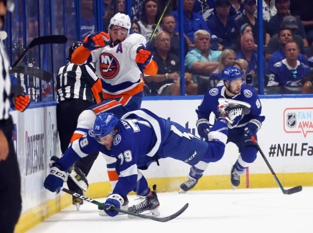 Cal Clutterbuck of the New York Islanders is hit by Ross Colton of the Tampa Bay Lightning in Game One of the Stanley Cup Semifinals during the 2021...