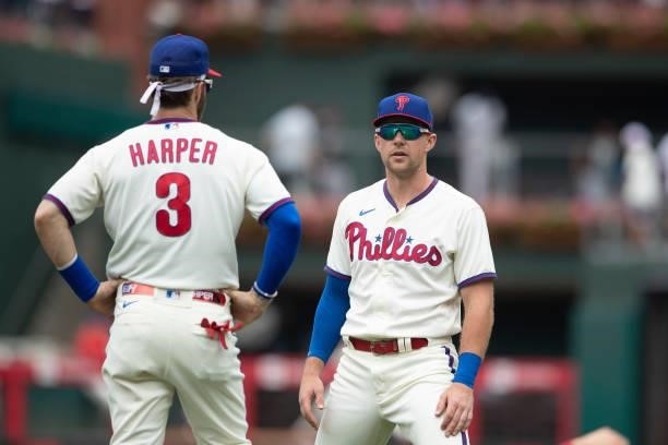 Bryce Harper of the Philadelphia Phillies talks to Rhys Hoskins prior to the game against the New York Yankees at Citizens Bank Park on June 13, 2021...