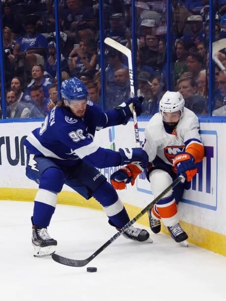 Jordan Eberle of the New York Islanders is checked by Mikhail Sergachev of the Tampa Bay Lightning in Game One of the Stanley Cup Semifinals during...