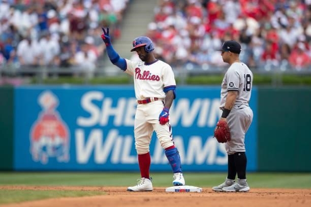 Andrew McCutchen of the Philadelphia Phillies reacts in front of Rougned Odor of the New York Yankees at Citizens Bank Park on June 13, 2021 in...