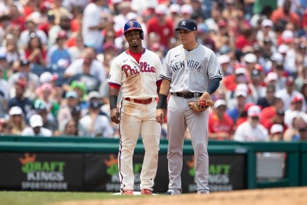 Jean Segura of the Philadelphia Phillies and Gio Urshela of the New York Yankees look on at Citizens Bank Park on June 13, 2021 in Philadelphia,...