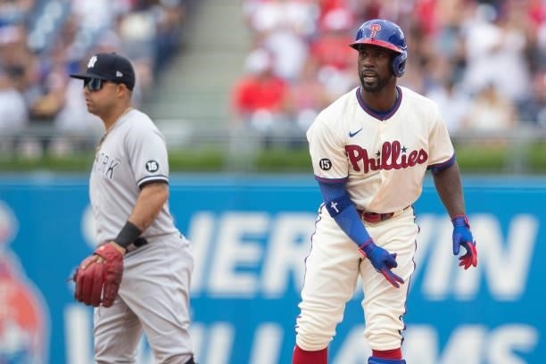 Andrew McCutchen of the Philadelphia Phillies reacts in front of Rougned Odor of the New York Yankees at Citizens Bank Park on June 13, 2021 in...